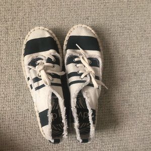 Striped cream and black shoes